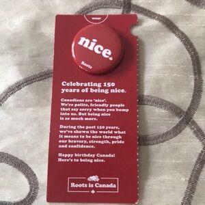Roots 'nice' Red Pin Badge